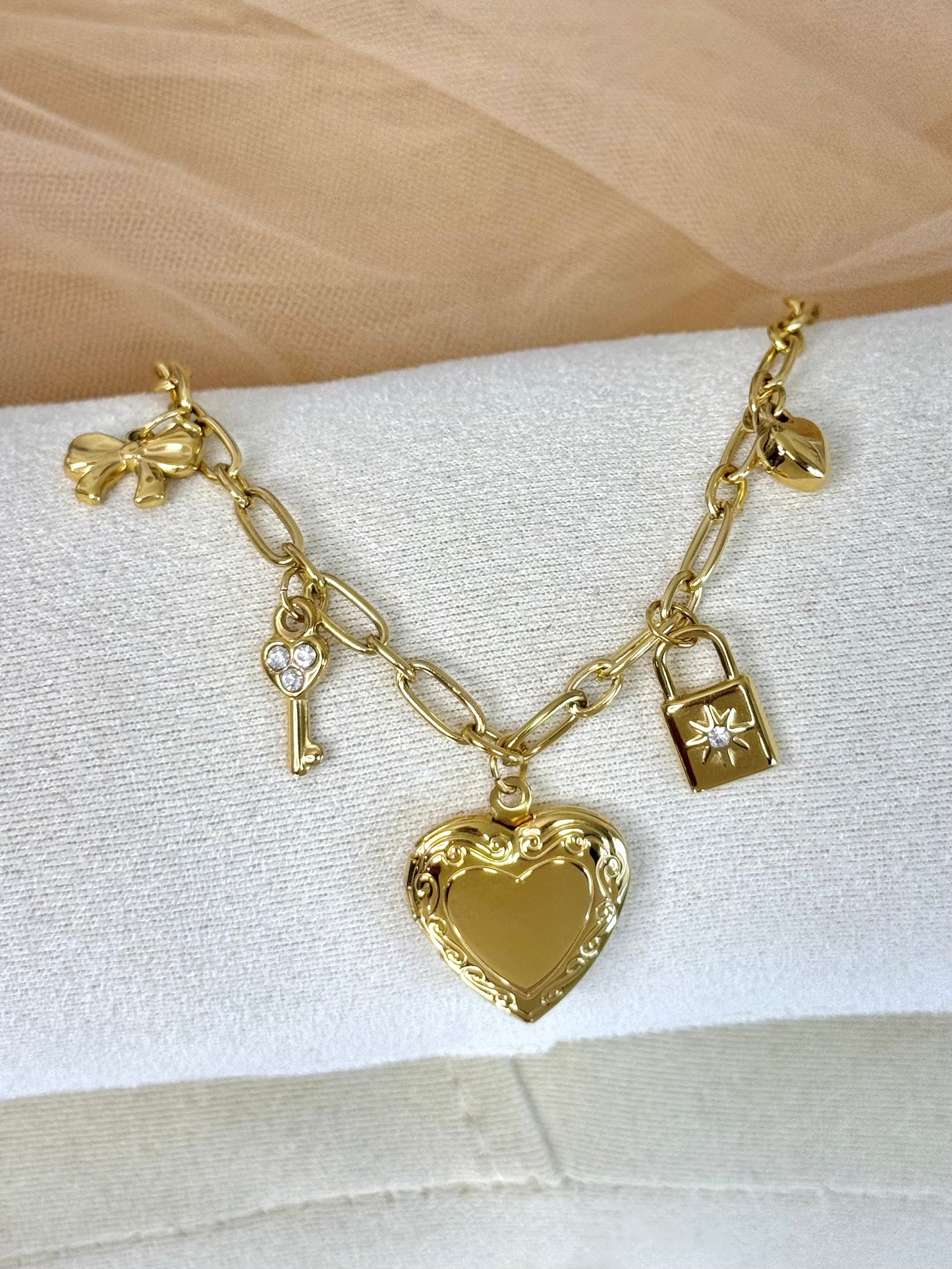 timeless jewellery, perfect gift for her, elegant bracelet, charm bracelet, best gift for her, classic gold chain bracelet, stylish gift, statement bracelet, versatile bracelet, bracelet Australia, gold bracelet, lucky charm, cute bracelet, dangling bracelet, bow design bracelet, heart design bracelet, star design bracelet, pearl bracelet, locket design bracelet