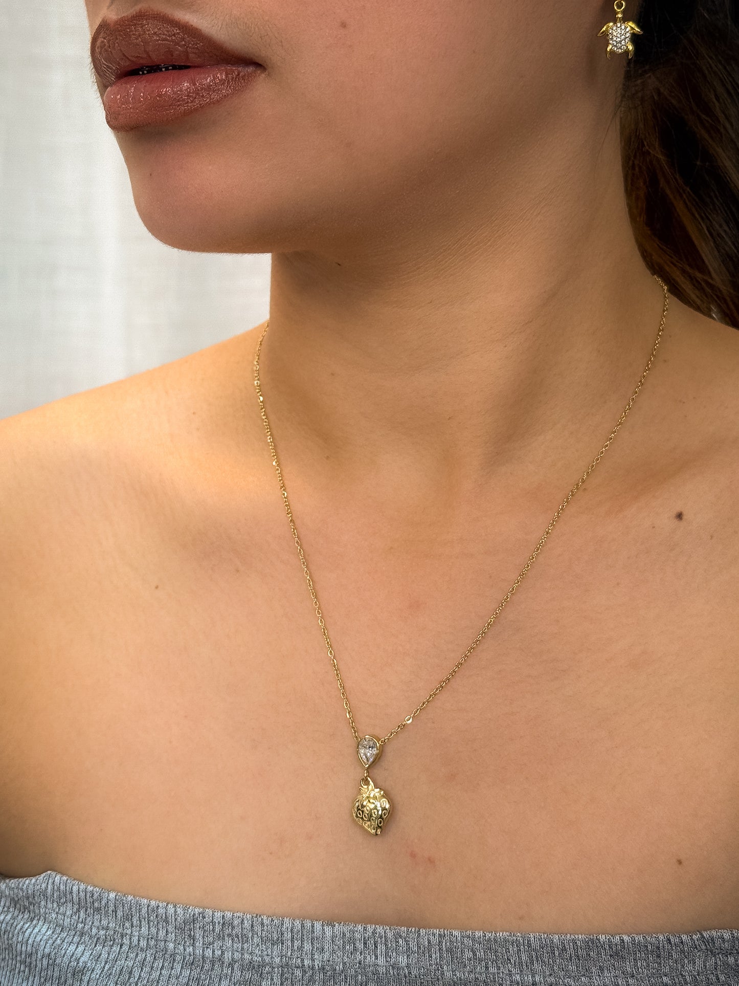 gold necklace, timeless jewellery, perfect gift for her, elegant necklace, charm necklace, best gift for her, classic gold chain necklace, stylish gift, statement necklace, versatile necklace, necklace Australia, link chain necklace, interlocking pendant necklace, y-shaped necklace, necklace with stone pendant, necklace with bold pendant, pendant with stones, necklace with gem pendant, necklace with colored stone pendant, gem necklace, strawberry pendant necklace, charm necklace