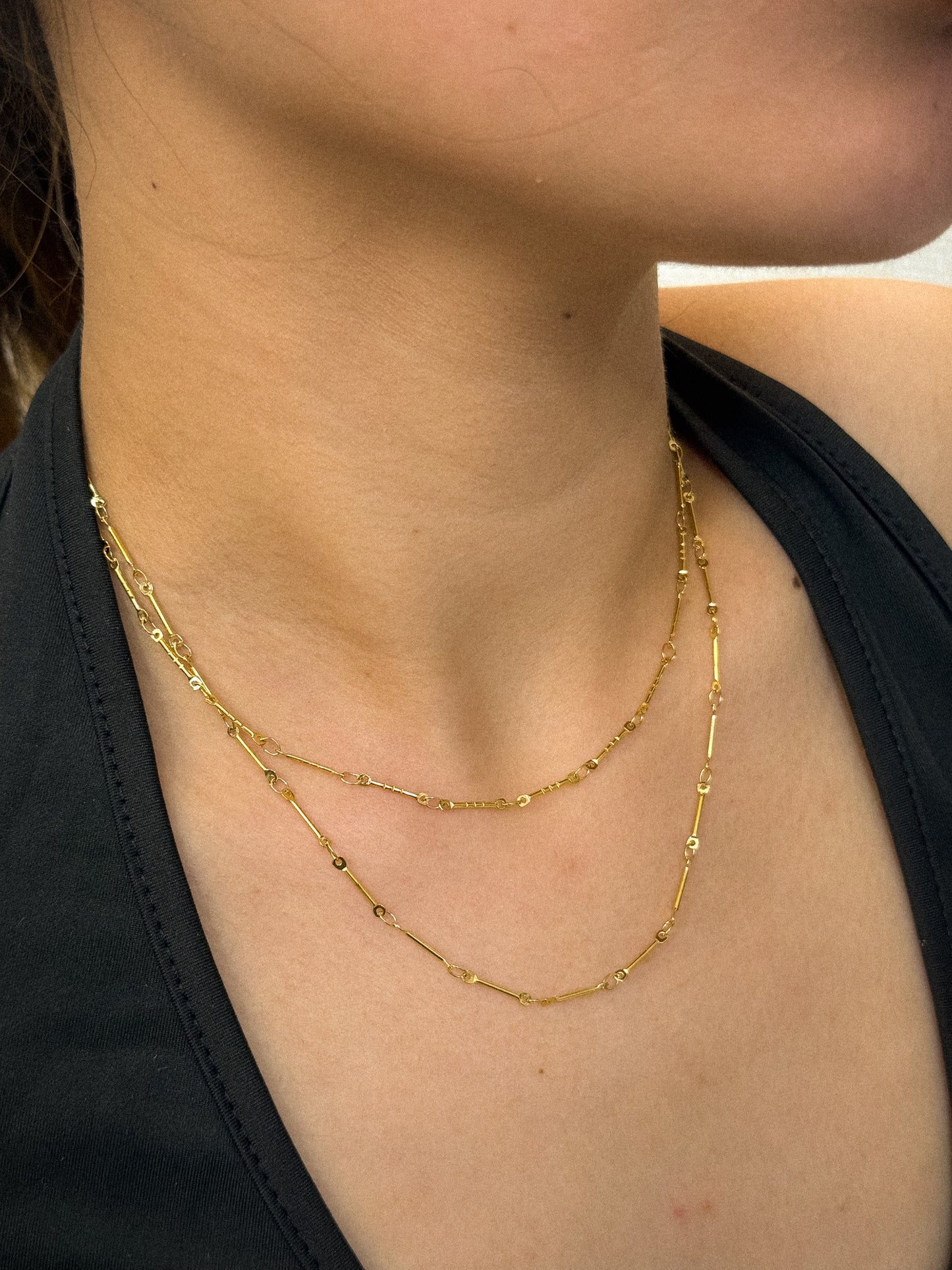 gold necklace, timeless jewellery, perfect gift for her, elegant necklace, charm necklace, best gift for her, classic gold chain necklace, stylish gift, statement necklace, versatile necklace, necklace Australia, link chain necklace, interlocking pendant necklace, y-shaped necklace, necklace with stone pendant, necklace with minimalist pendant, pendant with stones, necklace with gem pendant, minimalist design necklace, wave chain necklace, wave chain choker, thin bead choker necklace, bead necklace