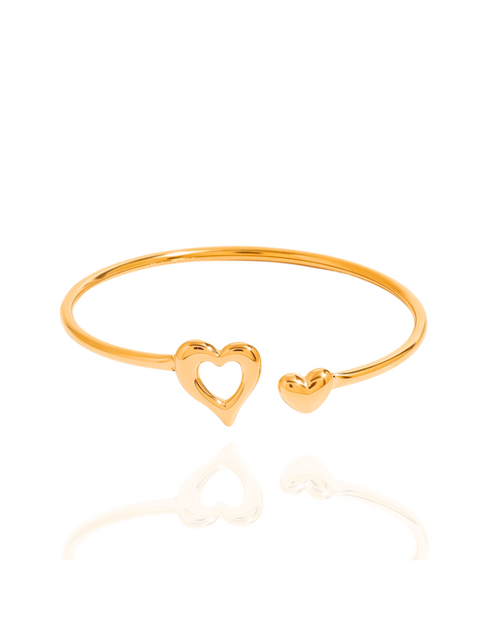 Gold bangle with heart designs on a white background, dainty gold heart bangle, polished gold heart bracelet, everyday wear, minimalist gold heart jewellery