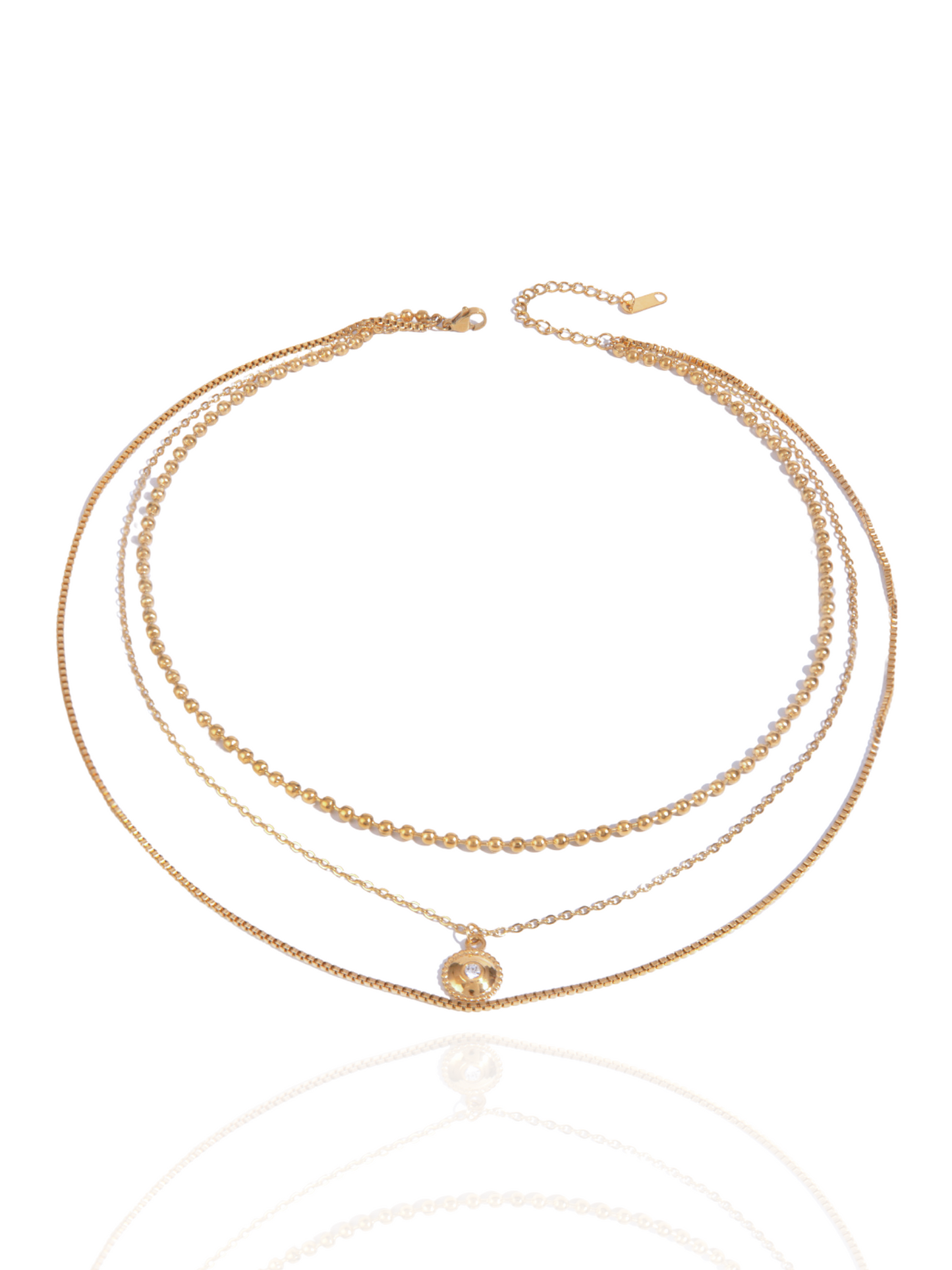 Three gold necklaces on a white background, layered, layered necklace. circle pendant, circle charm, everyday wear