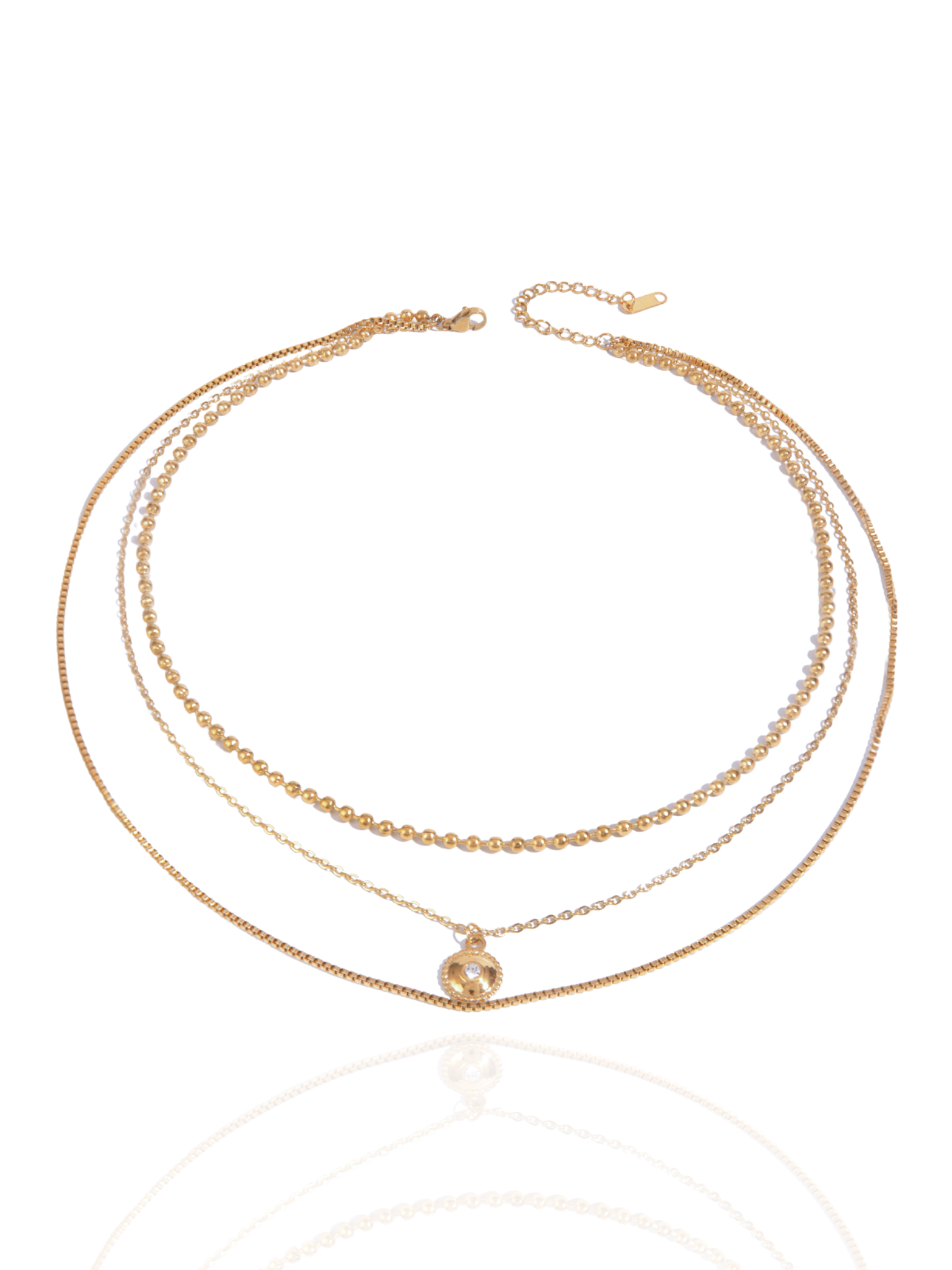 Three gold necklaces on a white background, layered, layered necklace. circle pendant, circle charm, everyday wear