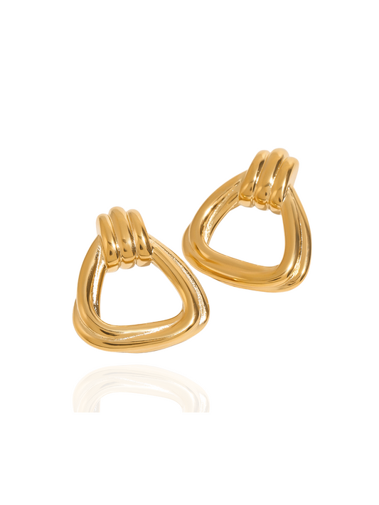 Pair of gold huggie earrings on a white background, dainty gold huggies, small gold huggie earrings, everyday gold huggies
