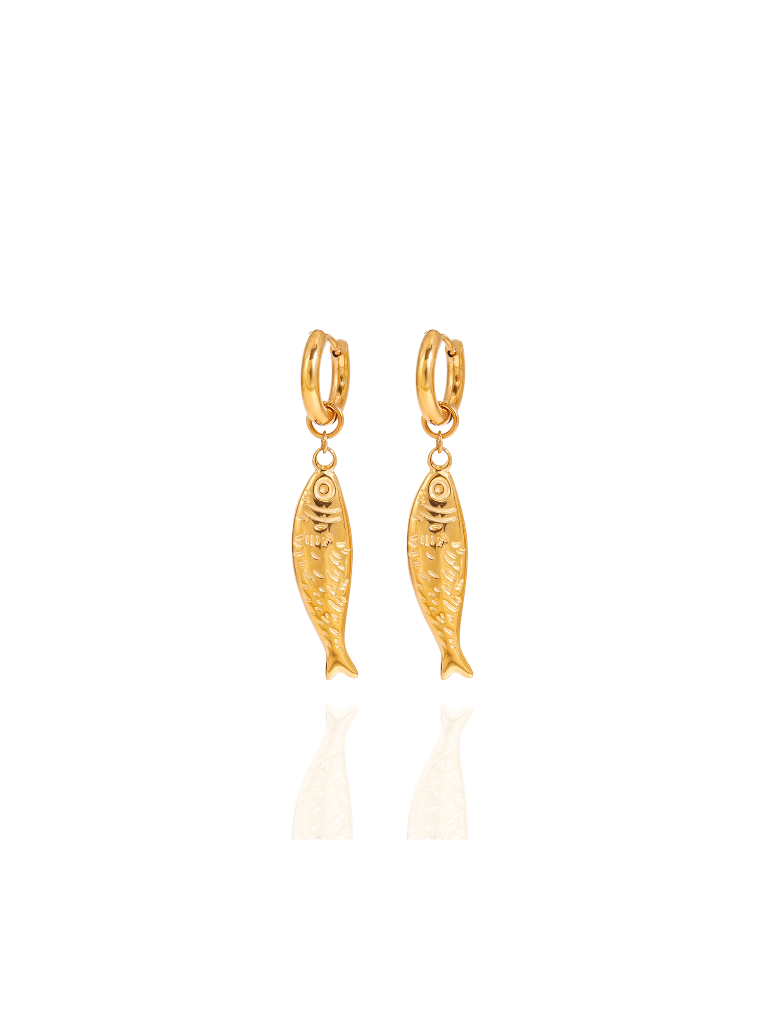 Gold fish-shaped earrings on a white background, fish huggies, dainty fish huggies gold, ocean inspired jewellery