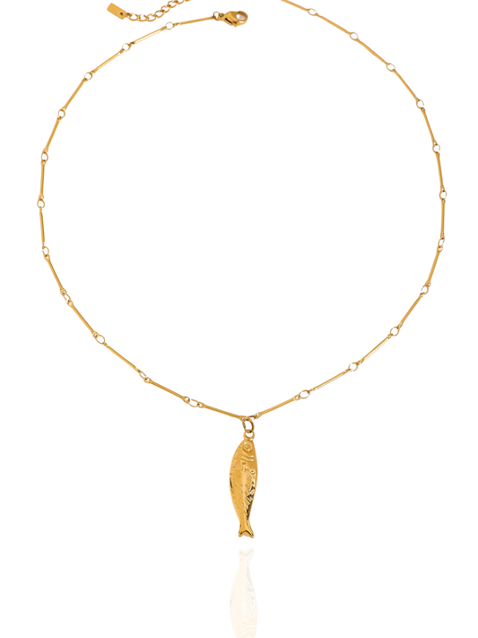 Gold necklace with a fish pendant on a white background, dainty gold fish charm necklace, lucky fish pendant, polished gold necklace, delicate fish shaped pendant