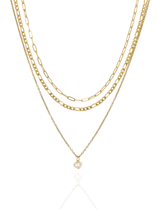 Three gold necklaces with a pearl pendant on a white background, layered, layered necklace, pearl pendant, dainty pearl charm, minimalist gold layered necklace with pearl charm, pearl drop layered gold necklace