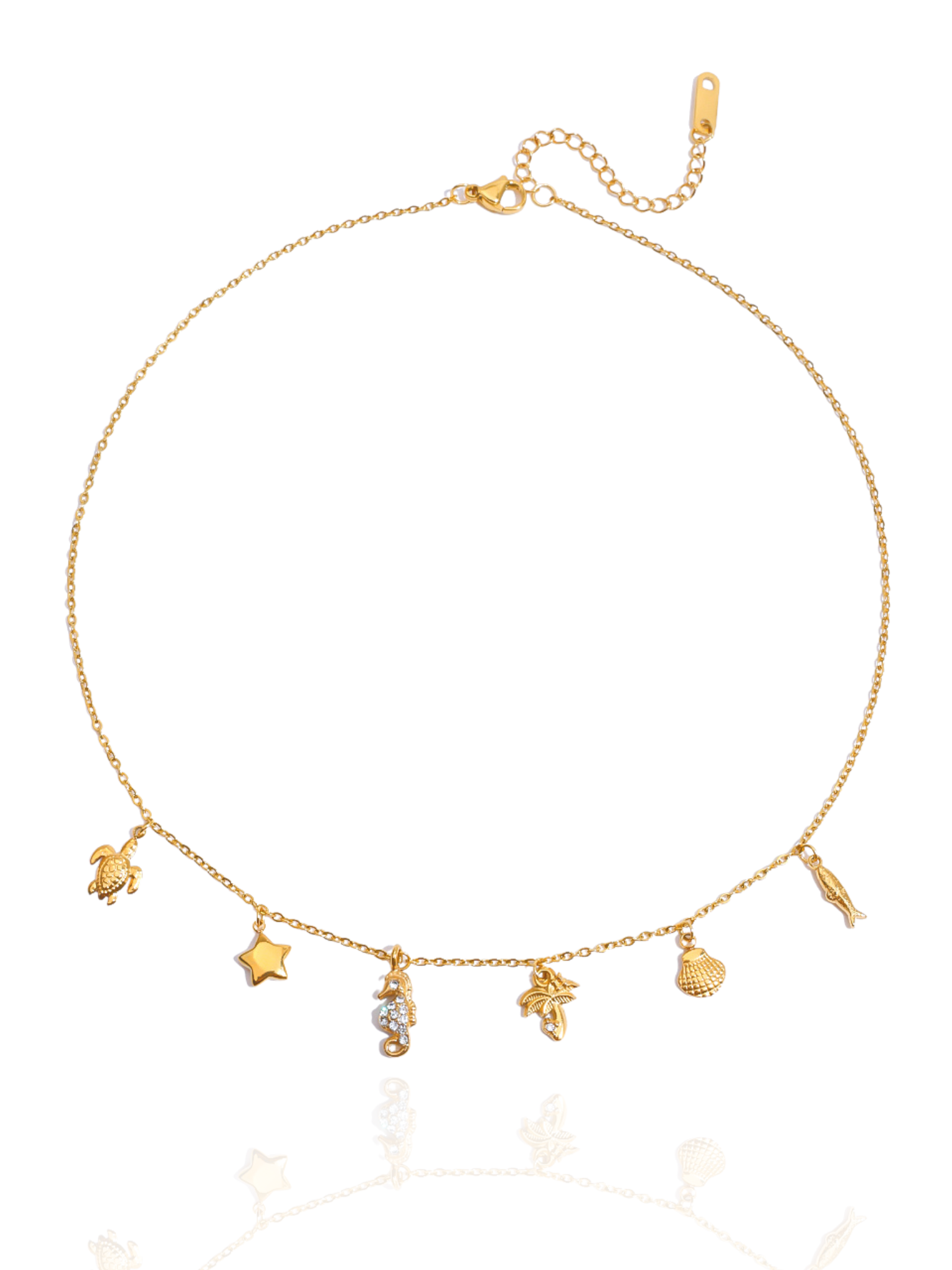 Gold necklace with various charms on a white background, sea-inspired charms, shell pendants, minimalist necklace, turtle charm, sea horse charm, summer wear