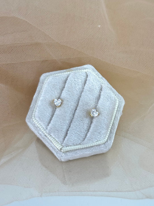 Hexagonal gray jewelry box with heart-shaped earrings on a beige fabric background, perfect gift for her, heart shaped, heart stud earrings, stud earrings, timeless, classy look, everyday wear